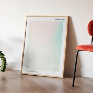 a framed poster with a gradient background, placed on a wooden floor next to a red chair.
