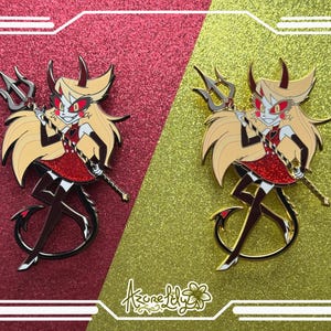 May include: Two enamel pins depicting a cartoon character with blonde hair, red eyes, and a red dress, holding a trident. The pins are set against a glittery red and gold background, with a white border. The text "Azure Lily" is at the bottom.