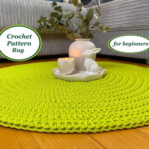 May include: A bright green crochet rug with a crocheted border. The rug is on a wooden floor and there is a vase with a white bunny figurine on top of it. The text "Crochet Pattern Rug" is in a green circle and the text "for beginners" is in a green circle.