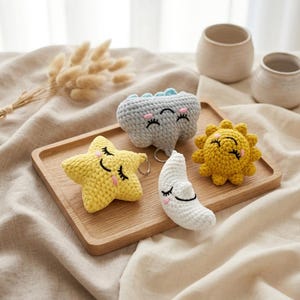 May include: A white ceramic mug with a black handle and the text "But First, Coffee" in a bold, black font. The mug is set against a blurred background, suggesting a cozy setting.