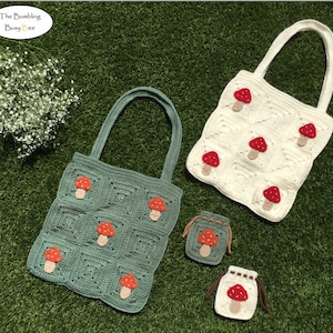 May include: Two crocheted tote bags with mushroom designs. One bag is green and the other is white. There are also two smaller crocheted bags with mushroom designs.