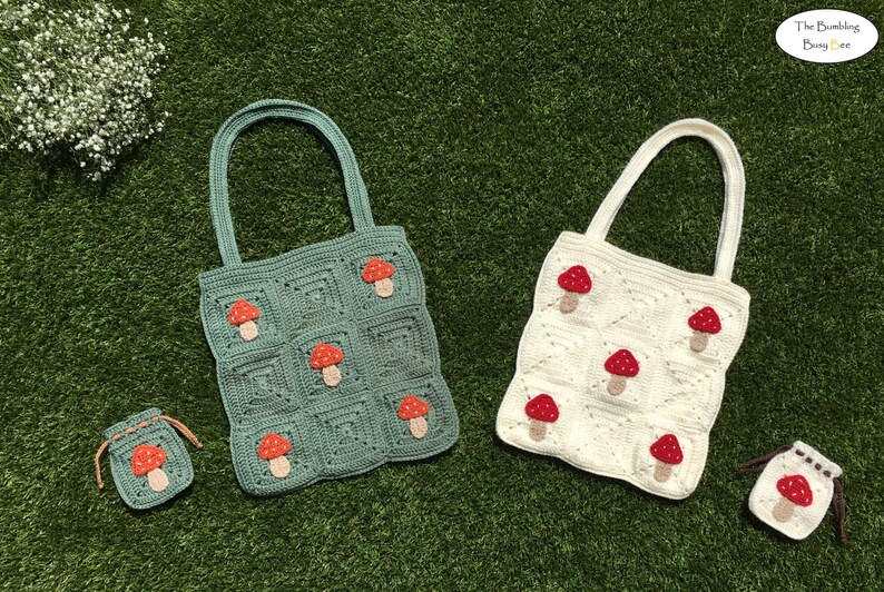 May include: Two crocheted tote bags with mushroom designs. The larger bag is green with red mushrooms and the smaller bag is white with red mushrooms. Both bags have matching drawstring pouches with red mushrooms.