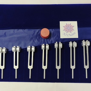 9 chakra weighted tuning fork set for sound healing meditation with activator and printed pouch