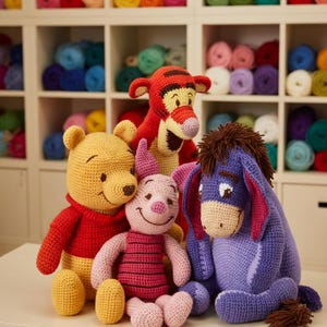 May include: A group of handmade crochet Winnie the Pooh characters, including Pooh, Piglet, Tigger, and Eeyore. The toys are in their signature colors: yellow, pink, red, and purple. The background features shelves filled with colorful yarn.
