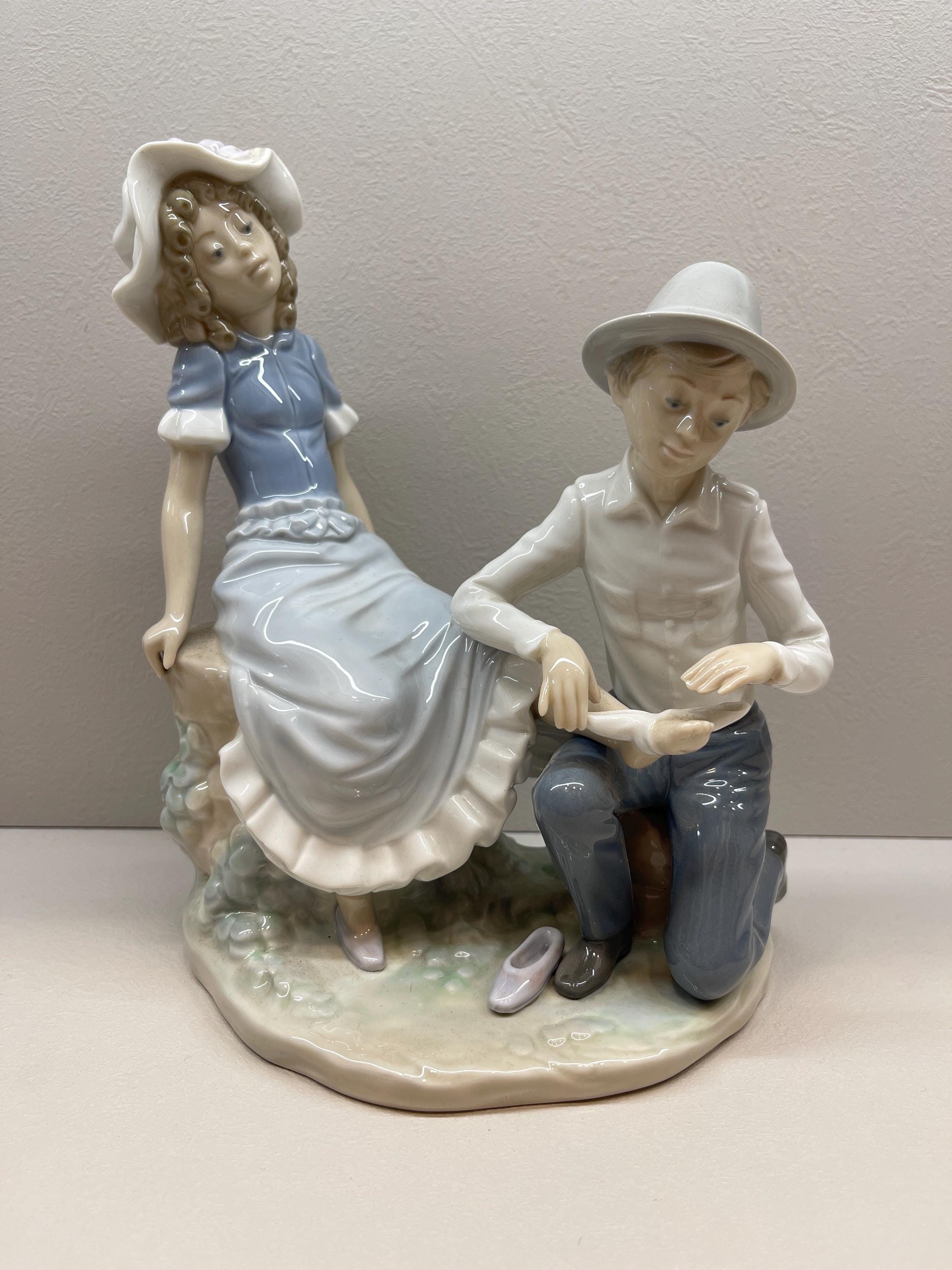 NAO by Lladro 0448 – Boy Bandaging Girl's Foot Figurine | Vintage