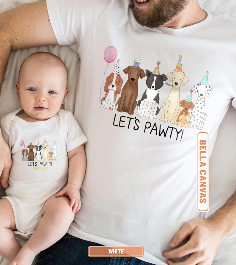 May include: White t-shirts and baby onesie with a "Let's Pawty!" graphic featuring cartoon dogs wearing party hats and holding a balloon. The onesie is worn by a baby, and the t-shirt is worn by an adult.