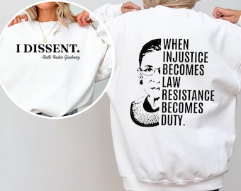 May include: White sweatshirt with a black and white image of Ruth Bader Ginsburg and the text "When injustice becomes law resistance becomes duty."