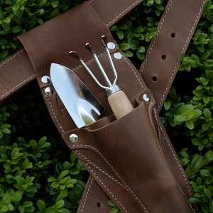 Hori Hori Leather Sheath belt with a separate pruner pocket that is attachable to the belt.