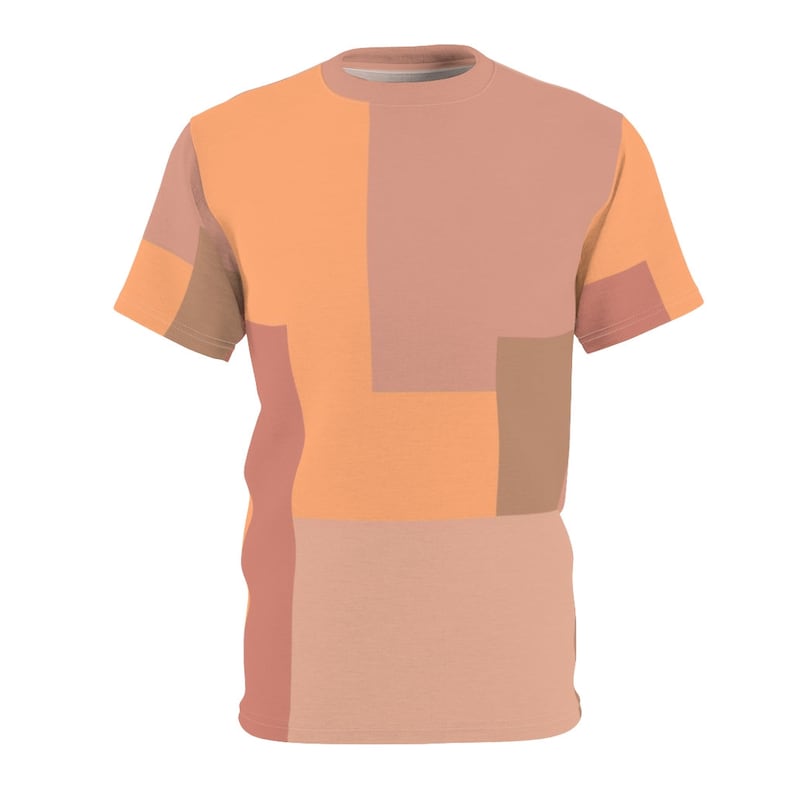 K&ouml;nnte beinhalten: Ein T-Shirt mit kurzen &Auml;rmeln und einem geometrischen Muster in Orange-, Pfirsich- und Braunt&ouml;nen.