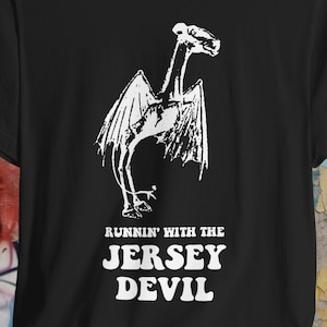 Runnin&#39; with the Jersey Devil T-Shirt | Cryptid Cryptozoology Shirt | Funny Unisex Tee | Paranormal Jersey Devil Gift | Pine Barrens Shirt