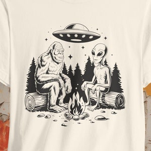 Bigfoot Alien UFO T-shirt Cryptid Campfire Tee Funny Sasquatch Shirt Vintage UFO Graphic Gift for Bigfoot Fans and Cryptid Lovers
