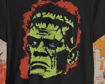 May include: Black t-shirt with a green and red graphic of Frankenstein's monster's face. The text "CRYPTO" is printed on the shirt.