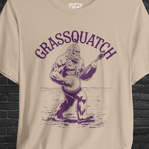 Grassquatch Bigfoot Banjo T-shirt Sasquatch Bluegrass Tee Funny Cryptid Music Shirt Gift for Banjo Players and Bigfoot Fans
