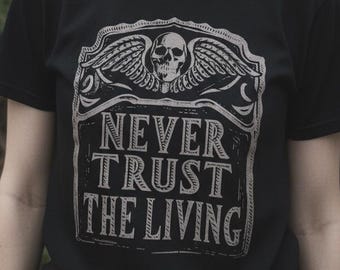 Never Trust the Living Tee, Gothic Dark Humor Shirt, Gravestone Graphic T-Shirt, Cemetery Goth Apparel, Unisex Dark Tee, Funny Gothic Shirt