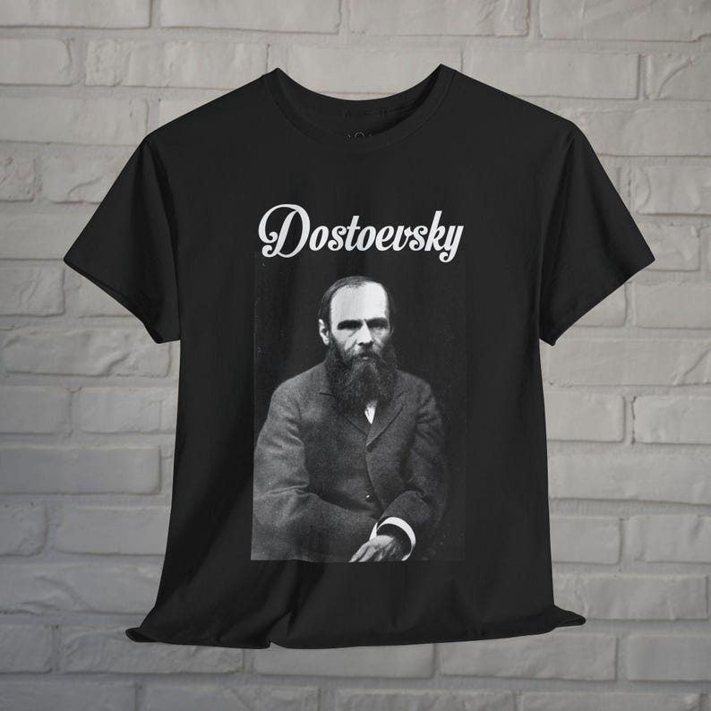 a black t - shirt with a picture of a man with a beard