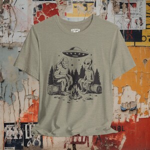 Bigfoot Alien UFO T-shirt Cryptid Campfire Tee Funny Sasquatch Shirt Vintage UFO Graphic Gift for Bigfoot Fans and Cryptid Lovers Athletic Heather