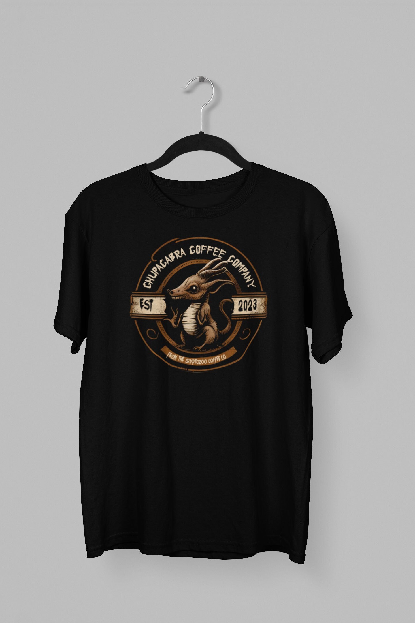 Discover CHUPACABRA COFFEE COMPANY T-shirt - Unisex Heavy Cotton Tee- Cryptozoology, Cryptid, Sasquatch, Mothman, Espresso