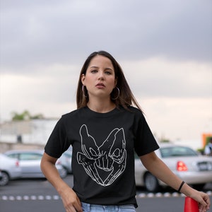 Model wearing a Labyrinth Movie T-Shirt with iconic Helping Hands design. This fantasy film tee captures the essence of the 80s cult classic, perfect for any David Bowie fan or lover of the film.