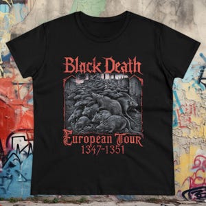 Black metal shirt for ladies featuring a death metal-inspired design with a plague doctor and rats. European tour-style tee perfect for fans of doom metal, goth fashion, deathrock hoodies, and dark aesthetics.