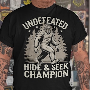 Bigfoot T-Shirt Undefeated Hide and Seek Comfort Colors Cryptid Sasquatch Shirt Funny Bigfoot Outdoors Gift for Bigfoot Fans Cryptozoology