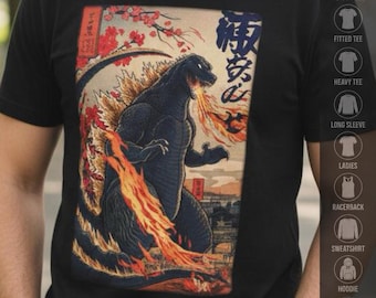 May include: A black t-shirt featuring a graphic print of a dark, reptilian monster breathing fire. The artwork includes red cherry blossom branches, Japanese kanji characters, and a landscape background. The design is centered on the chest area.
