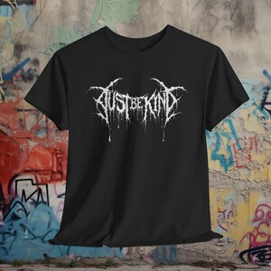 Hardcore crust punk tee with an ironic "Just Be Kind" message in a death metal font. Funny music gift for punk rockers and heavy metal fans. Available as a unisex T-shirt, sweatshirt, and long sleeve.