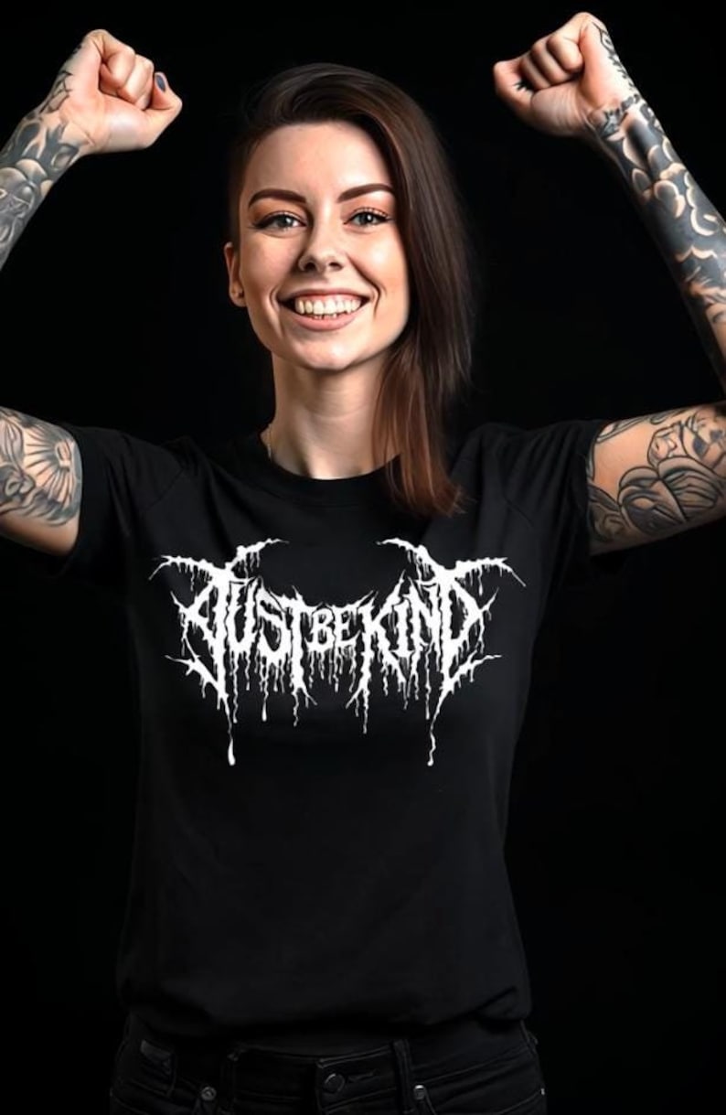 "Just Be Kind" Death Metal-inspired tee featuring bold, heavy metal-style lettering. Available as a unisex t-shirt, perfect for metalheads with humor.