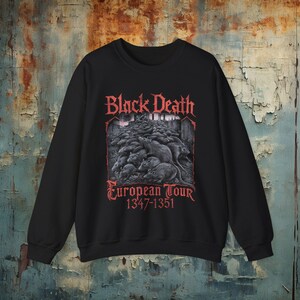 Black death metal shirt with a European tour-inspired plague doctor and rats design. Comes in t-shirts, hoodies, sweatshirts, and long sleeves, ideal for doom metal, deathrock, and goth fashion lovers.