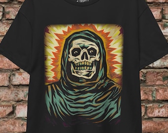 May include: A black t-shirt with a graphic print of a skull wearing a hooded robe. The skull is surrounded by a yellow, orange, and red burst of light.