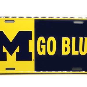 Officially Licensed UNIVERSITY of MICHIGAN Wolverines 3D EMBOSSED Metal Car Novelty License Plate Auto Tag. Go Blue
