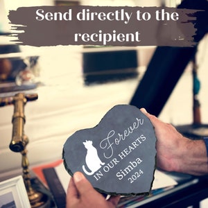 May include: Heart-shaped slate memorial stone with a white cat silhouette and the words "Forever In Our Hearts Simba 2024". The text "Send directly to the recipient" is at the top. A touching pet loss gift.