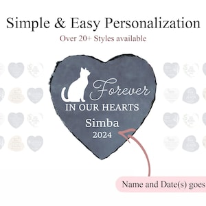 May include: A heart-shaped memorial stone with a white cat silhouette and the words "Forever in Our Hearts." The name "Simba" and the year "2024" are below. The text "Simple & Easy Personalization" is at the top. Additional heart-shaped memorial stones are in the background.