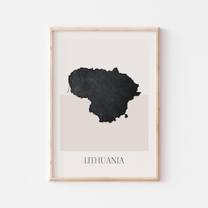May include: Framed art print featuring a black silhouette of Lithuania on a beige and white background. The word "LITHUANIA" is printed in black at the bottom of the print. The artwork is encased in a light-colored wooden frame.