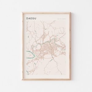 May include: A beige and brown map print of Daegu, South Korea, in a light wood frame.