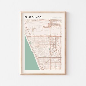 May include: A white ceramic mug with a black handle and the text "But First, Coffee" in a bold, black font. The mug is set against a blurred background, suggesting a cozy setting.