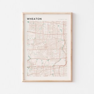 May include: A white ceramic mug with a black handle and the text "But First, Coffee" in a black, bold font. The mug is on a white surface.