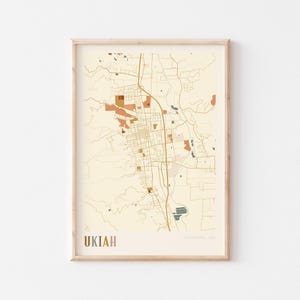 May include: A white ceramic mug with a black handle and the text "But First, Coffee" in a black, handwritten-style font. The mug is on a white surface.