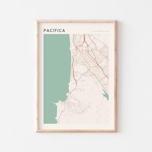 May include: Framed map print of Pacifica, California, USA. The map features a light beige background with brown road details and a teal green coastal area. The word "PACIFICA" is printed in black at the top left.