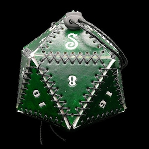May include: A green leather dice bag with white stitching and black lacing. The bag is shaped like a twenty-sided die, with white numbers and a white stylized "S" on the surface. A black cord is attached for closure.