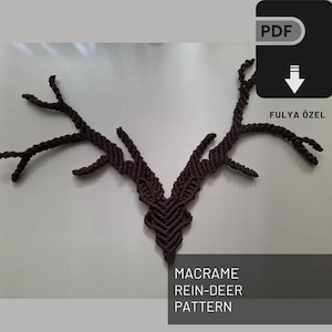 May include: A brown macrame reindeer head wall hanging pattern. The pattern is available as a PDF download. The text on the image reads "MACRAME REIN-DEER PATTERN FULYA ÖZEL"