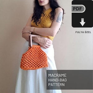 May include: A PDF pattern for a macrame hand-bag. The pattern is by Fulyä Özel. The image shows a woman holding a completed orange macrame bag with wooden handles.