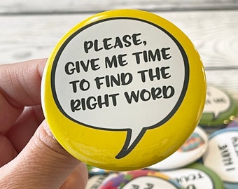 May include: A yellow button with a black border and the text "PLEASE, GIVE ME TIME TO FIND THE RIGHT WORD" in a white speech bubble. Other buttons with similar text and designs are visible.