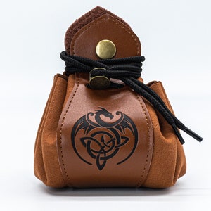 May include: A brown leather pouch with a black drawstring closure and a black dragon and knot design.