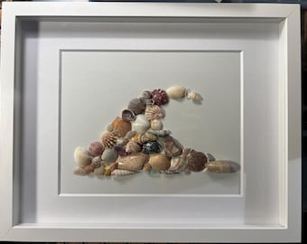 11x14” wave of seashells on display wall frame.