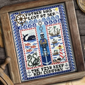 May include: A framed cross-stitch design with a nautical theme. The design features a skeleton with an anchor, a whale, an octopus, a lighthouse, and ships. The text reads "Father was lost at sea. The fish keep him company."