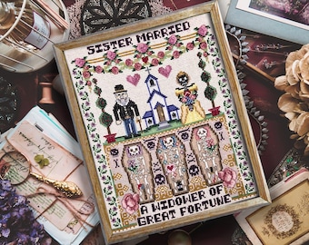 Puede incluir: Arte de punto de cruz enmarcado con el texto "Sister Married" y "A Widower of Great Fortune". El diseño presenta una pareja de esqueletos, una iglesia y ataúdes. La paleta de colores incluye rosa, verde y marrón.