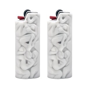 May include: Two white lighters with a unique, textured design featuring a repeating pattern of abstract shapes. The lighters have a red plastic top and a silver metal hinge.