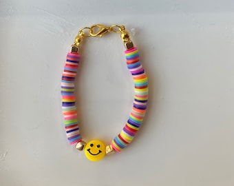Pulseira de miçangas com rosto sorridente