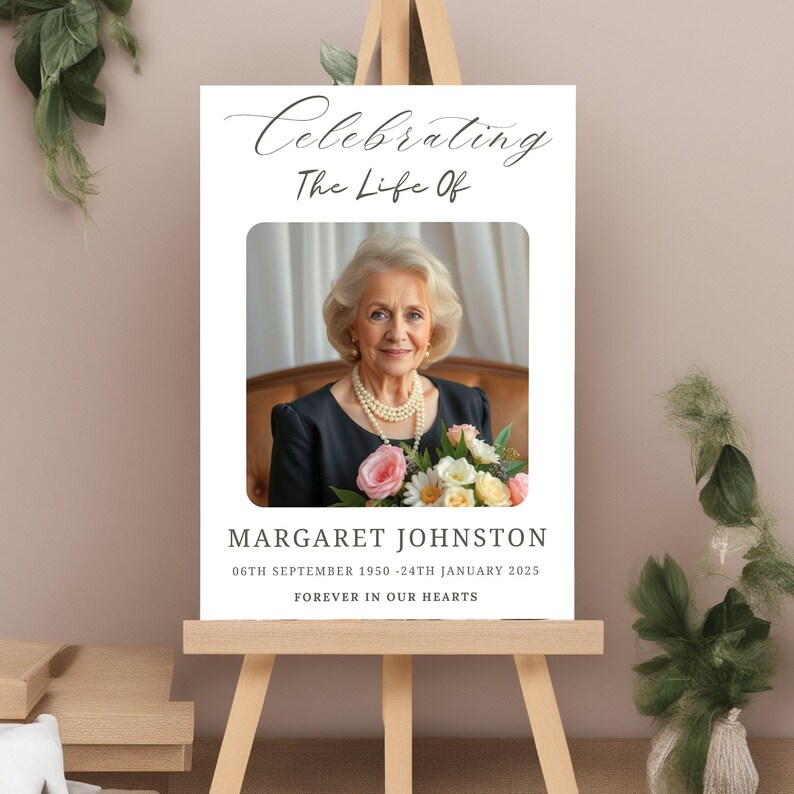 May include: A white memorial poster with a black and white photo of a woman holding a bouquet of flowers. The text reads "Celebrating The Life Of Margaret Johnston 06th September 1950 - 24th January 2025 Forever In Our Hearts."