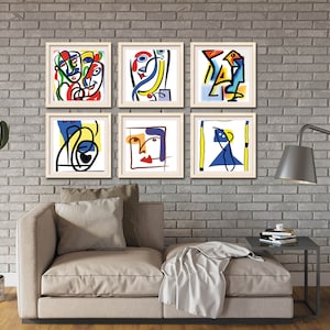 May include: Six framed abstract art prints with colorful geometric shapes and lines. The prints are arranged in a grid pattern on a brick wall.